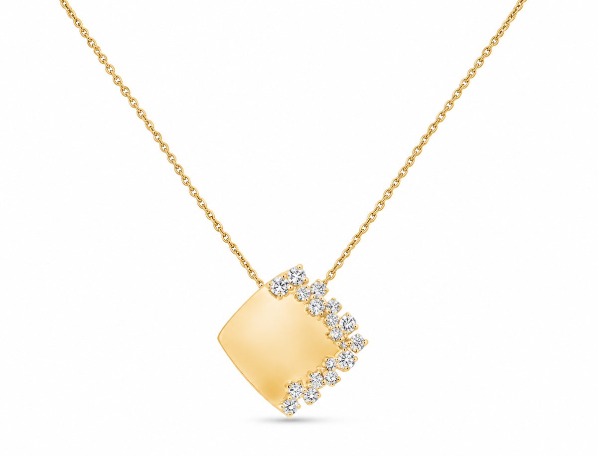 A gold pendant necklace featuring a square pendant with a curved border of small clear stones, shown on a clean white background.