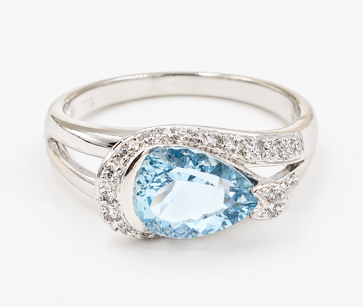Estate 18k White Gold Diamond & Aquamarine Gemstone Ring featuring a pear-shaped aquamarine with diamond accents.