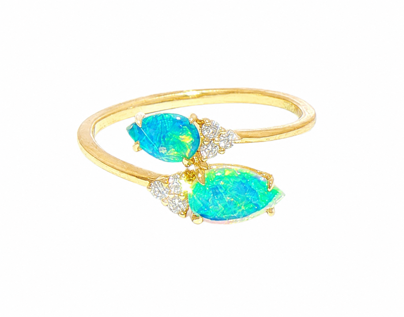A gold ring featuring two marquise-cut iridescent blue-green opal stones and small clear accent stones.