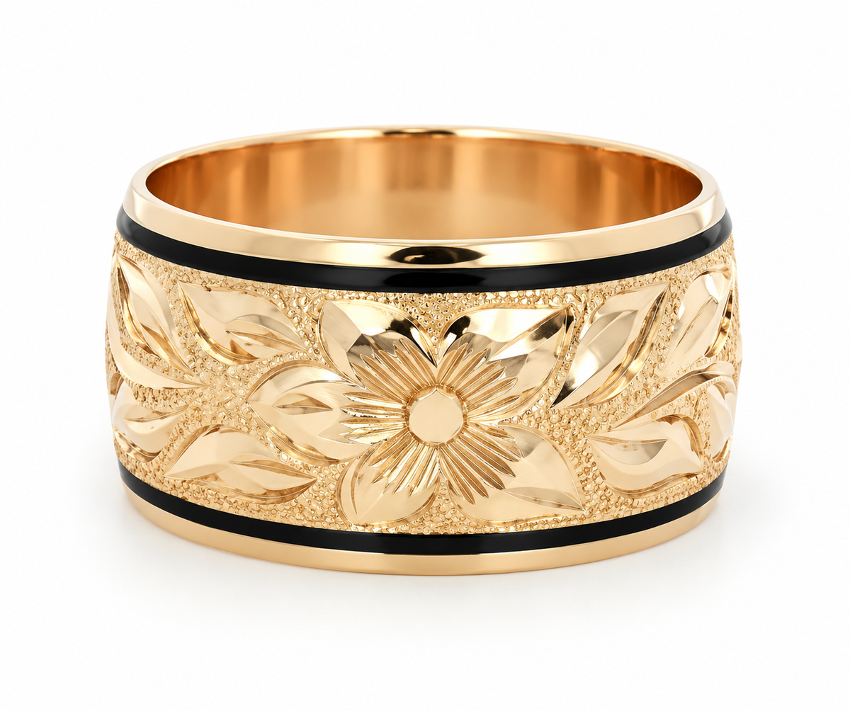 Kent Island Jewelry’s 14K Yellow Gold Floral Band: hand-engraved petals and black enamel border on a wide vintage band.
