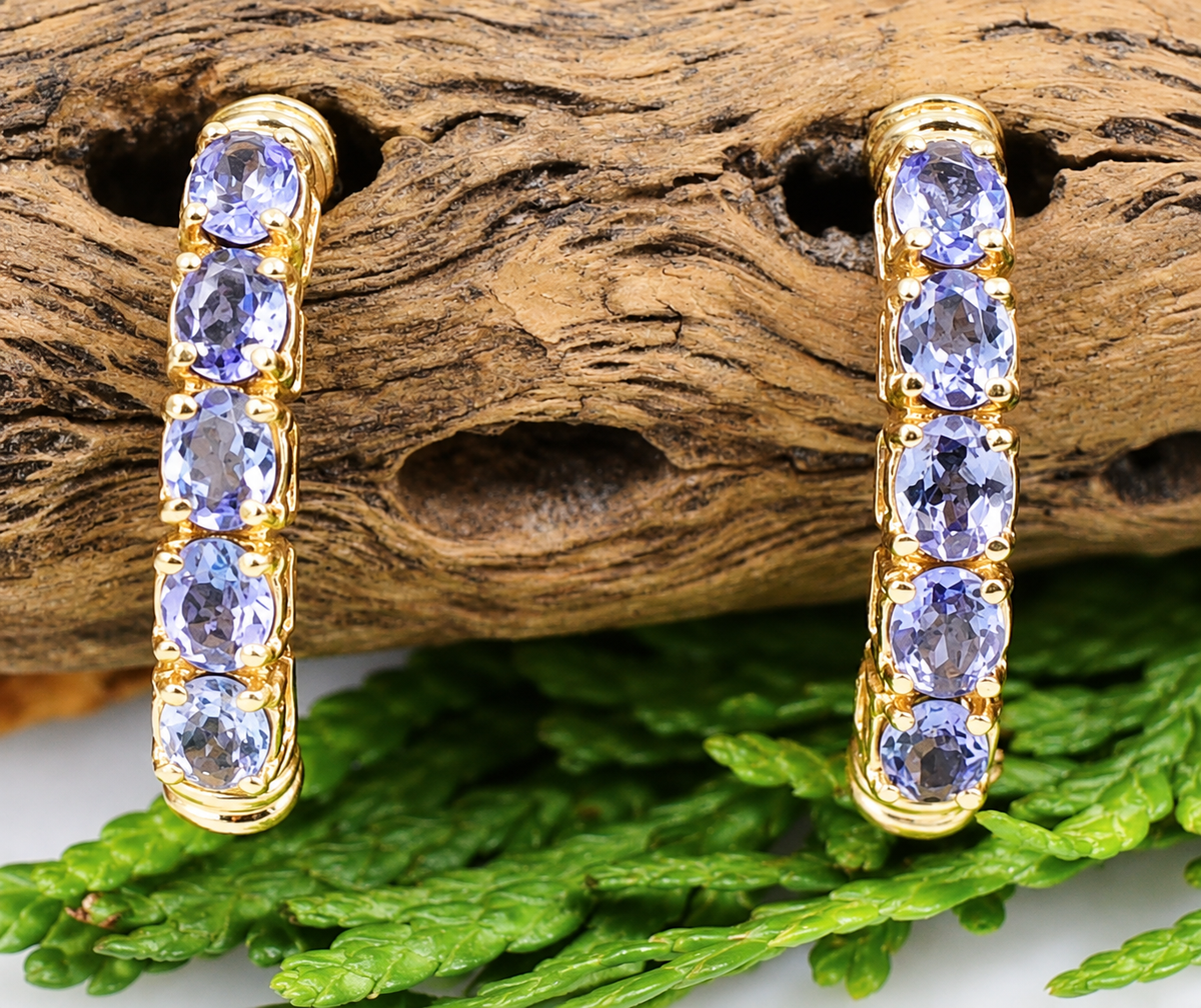 Estate 14k Yellow Gold Tanzanite Gemstone Half Hoop Earrings, each set with five oval tanzanite gemstones.