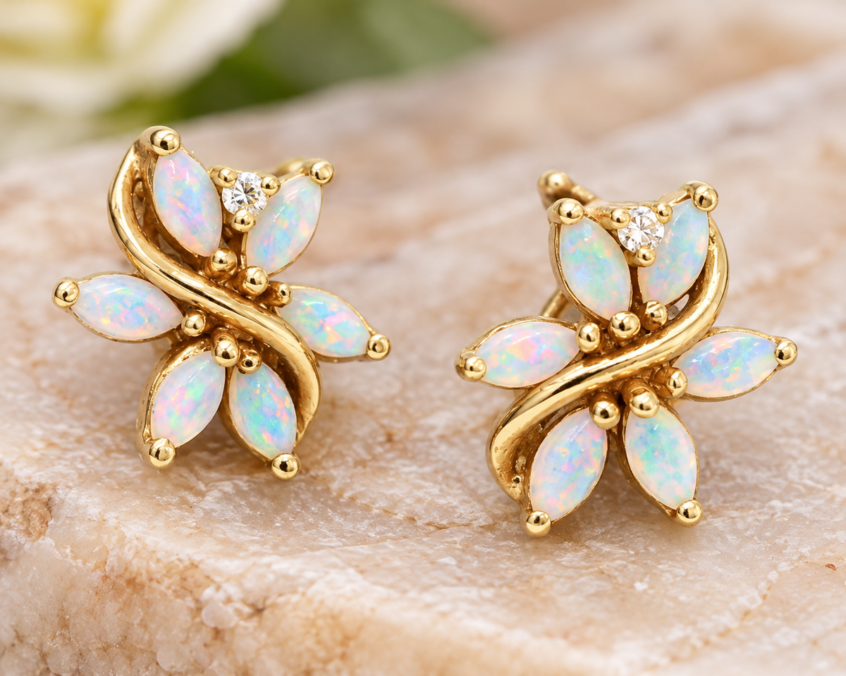 Estate 14k Yellow Gold Diamond & Fire Opal Gemstone Flower Studs featuring marquise-cut fire opals and a round diamond.