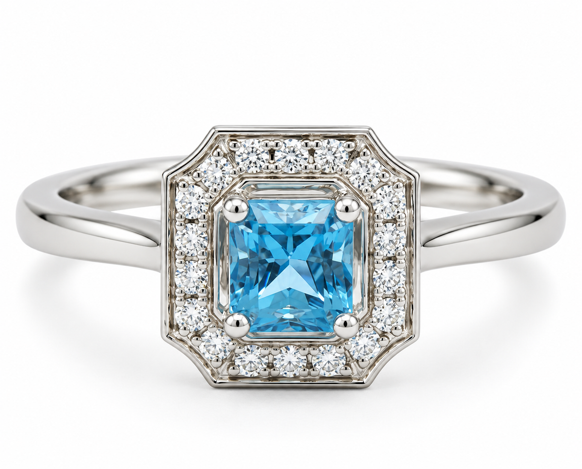 Kent Island Jewelry 14K white gold ring with emerald-cut aquamarine and diamond halo in an art deco-inspired setting.