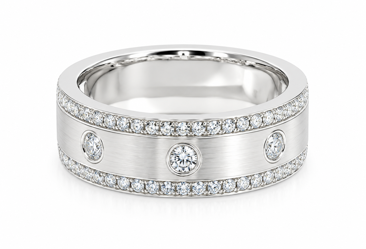 A white gold band ring featuring a brushed center channel flanked by rows of pavé-set round diamonds and three larger round center diamonds, shown on a clean white background.