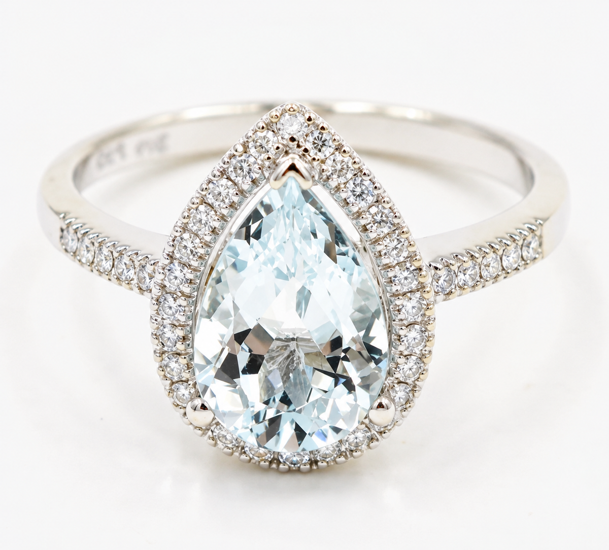 Estate 14k White Gold Diamond & Pear Cut Aquamarine Gemstone Ring with a diamond halo and diamond-encrusted band.