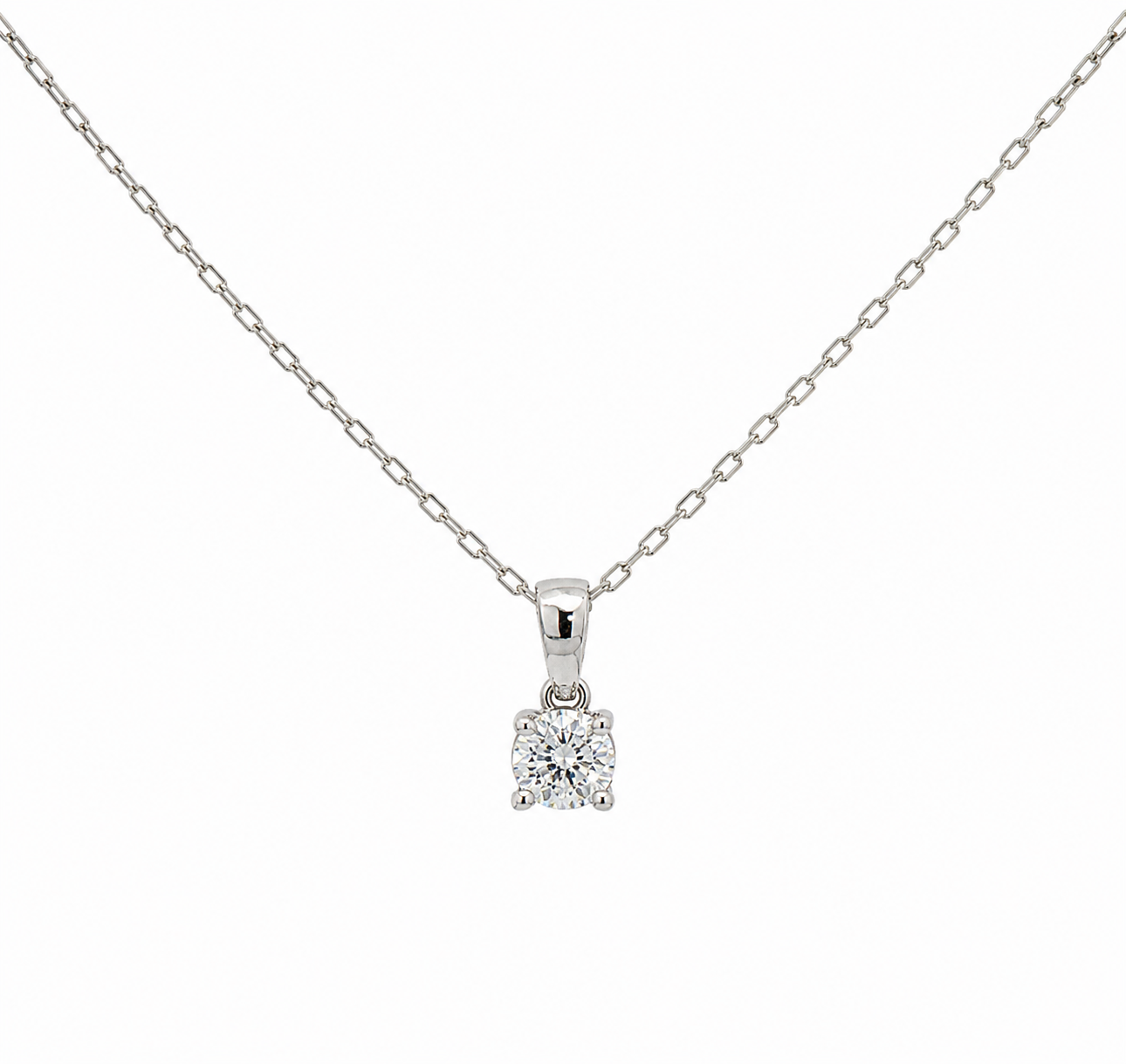 A white gold necklace with a small round diamond pendant in a four-prong setting, shown against a plain white background.