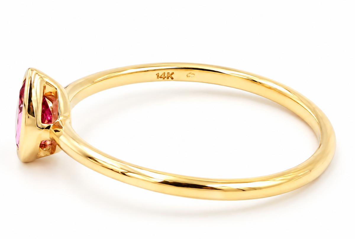 Estate 14k Yellow Gold Pear Cut Pink Tourmaline Gemstone Ring in 14k yellow gold with a pear-cut pink tourmaline.