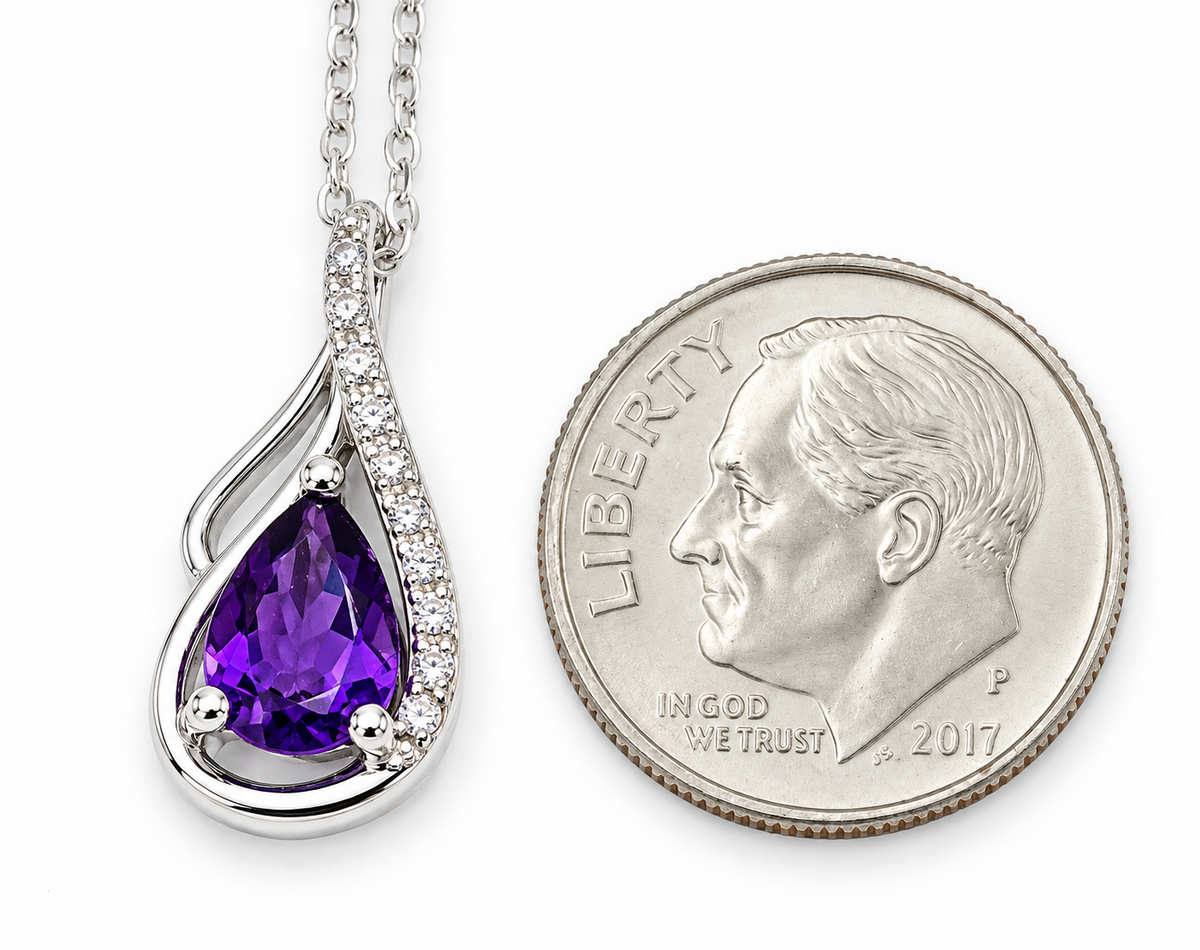 Kent Island Jewelry Estate 14k White Gold Diamond & Amethyst Gemstone Swirl Pendant on a silver chain, next to a US dime.