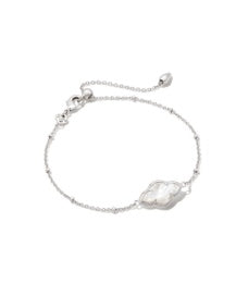 Kendra Scott ABBIE satellite chain bracelet in silver with an ivory mother of pearl cloud charm and adjustable clasp.