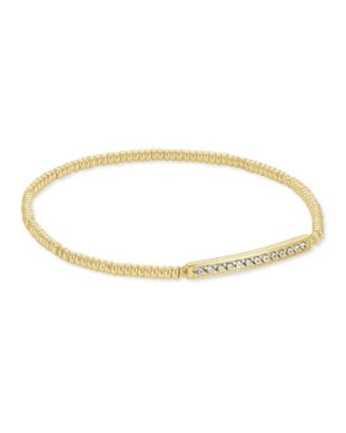 The Kendra Scott Addison Stretch Bracelet Gold Metal is your go-to stack staple with a textured band and straight bar.